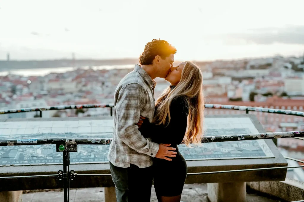 Couple celebrating their engagement in Alfama, Lisbon, photographed by a discreet proposal photographer 2